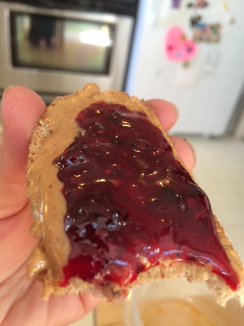 Toast with peanut butter and fresh blackberry jam.  