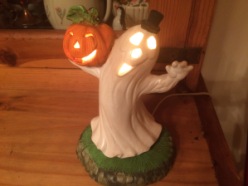 Ghostie Ghost, he was painted by Larry Fine, (of Three Stooges fame's) niece. I got him at a craft fair years ago. I love him. Halloween doesn't officially start until we light his light.